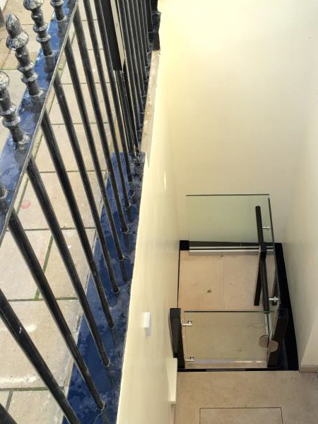 Lightwell lift located on the building's ground floor